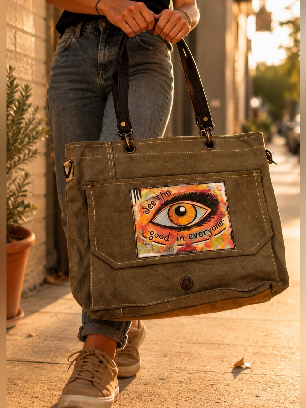 Vintage khaki canvas bag with black and tan tags